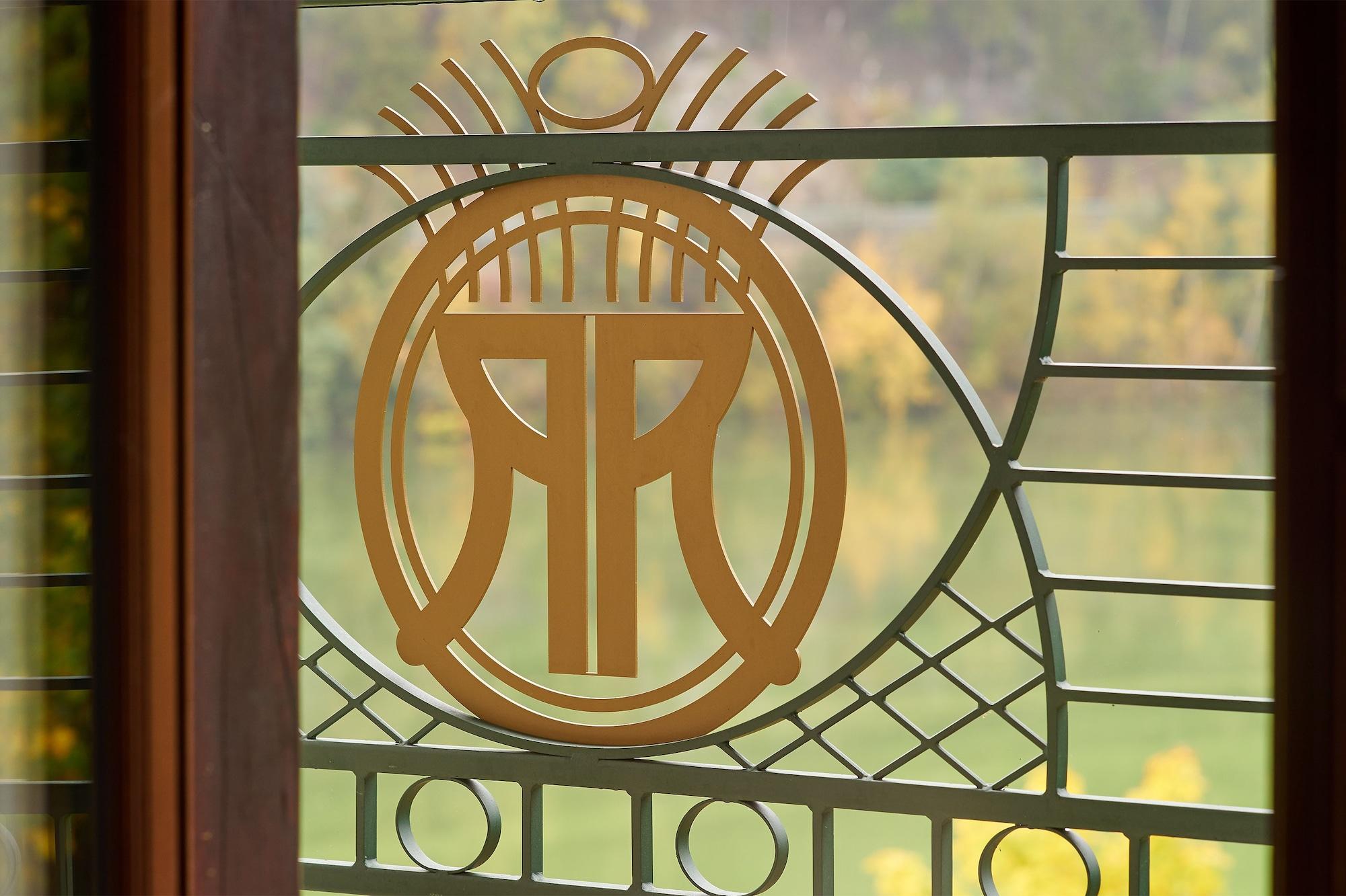 Retro Riverside Wellness Resort Карловы Вары Экстерьер фото The logo of the Swiss National Museum